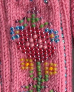 Bead Knitting used to embellish fingerless mittens.