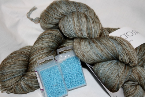Mad Tosh Prairie, Cove Colourway, and beads - I see a shawl in its future!