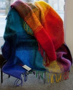 One of Melody's beautiful blankets made from local wool, spun and hand-dyed by Melody, and hand-dyed Mohair!  Warm and Cheerful.